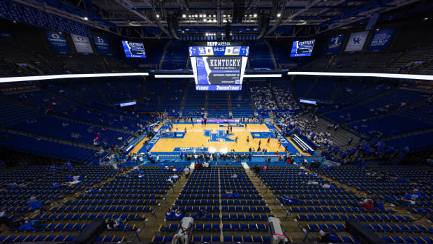 Feb 7, 2023; Lexington, Kentucky, USA; Fans make their way to their seats as players warm up before the game between the Kentucky Wildcats and the Arkansas Razorbacks at Rupp Arena at Central Bank Center. Mandatory Credit: Jordan Prather-USA TODAY Sports