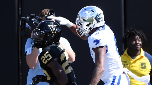 Sep 23, 2023; Nashville, Tennessee, USA; Kentucky Wildcats wide receiver Dane Key (6) pats the head of Vanderbilt Commodores cornerback Martel Hight (25) after a touchdown reception during the second half at FirstBank Stadium. Mandatory Credit: Christopher Hanewinckel-USA TODAY Sports