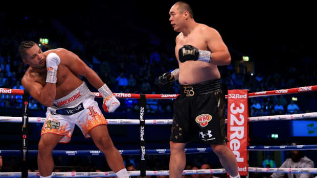       Zhilei Zhang punches Joe Joyce during the WBO Interim World Heavyweight Title fight between Zhilei Zhang and Joe Joyce at OVO Arena Wembley on September 23, 2023 in London, England. STEPHEN POND/GETTY IMAGES. 