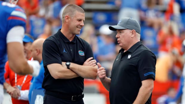 Sep 10, 2022; Gainesville, Florida, USA; Florida Gators head coach Billy Napier and Kentucky Wildcats head coach Mark Stoops greet prior to the game at Ben Hill Griffin Stadium. Mandatory Credit: Kim Klement-USA TODAY Sports