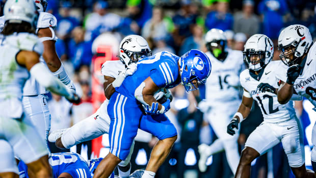 Lassiter Family Wears Split BYU/Kansas Uniforms For Support