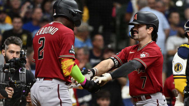 Corbin Carroll celebrates a third inning homer in Milwaukee with Geraldo Perdomo