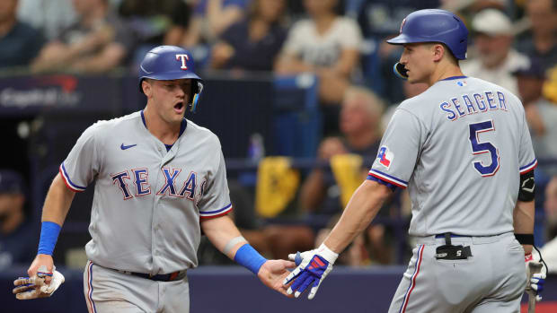 Texas Rangers third baseman Josh Jung, left, and shortstop Corey Seager, right, are still recovering from injuries this spring. Neither has played in a spring training game. Jung is recovering from a left calf strain and Seager is recovering from sports hernia surgery in December.