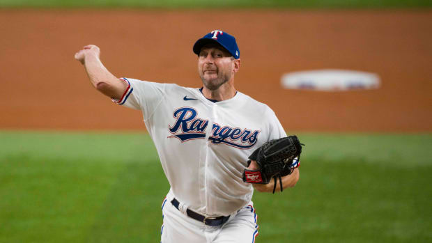 Tampa Bay Rays pitching coach Kyle Snyder, left, looks on as Shane  McClanahan holds his all-star jersey before a baseball game against the  Baltimore Orioles Saturday, July 16, 2022, in St. Petersburg