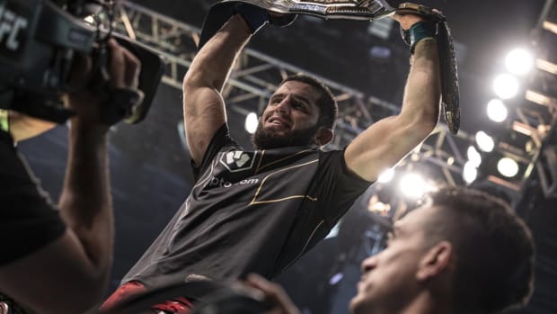 Islam Makhachev celebrates winning the UFC Lightweight Championship