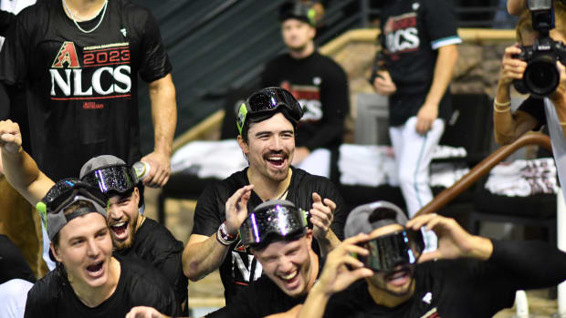 Corbin Carroll and teammates celebrate in the Pool at Chase Field after sweeping Dodgers in NLDS