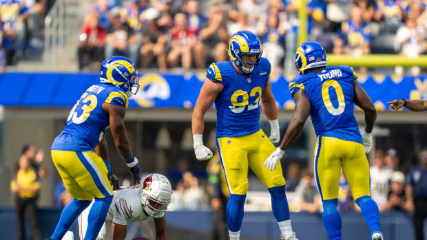 Los Angeles Rams' Ernest Jones (53), Jonah Williams (92) and Byron Young (0) celebrating a sack.