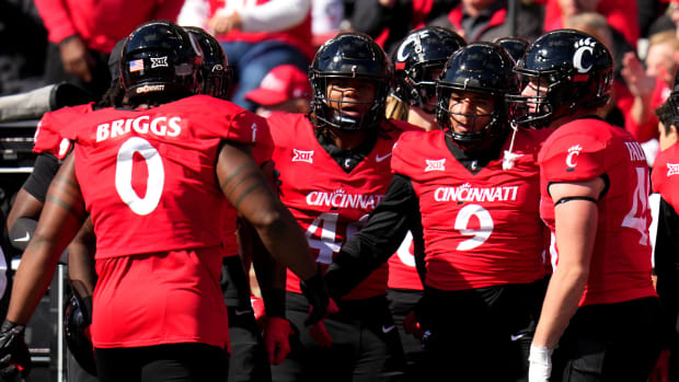 Commit to the grit: Inside Cincinnati football's climb from rock bottom to  College Football Playoff history - The Athletic