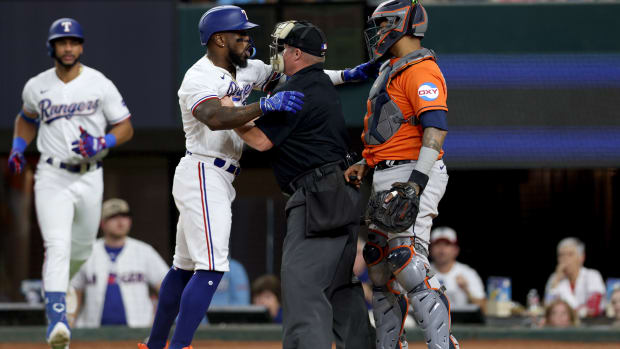 Houston Astros first baseman Jose Abreu (79) wipes sweat during the first  inning of a spring training game at The Ballpark of the Palm Beaches on  Saturday, Feb. 25, 2023 in West