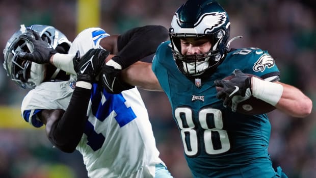 Philadelphia Eagles tight end Dallas Goedert (88) stiff arms Dallas Cowboys safety Markquese Bell (14) during the second half of an NFL football game Sunday, Nov. 5, 2023, in Philadelphia. (AP Photo/Matt Rourke)   