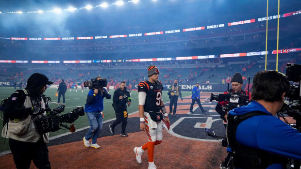 Cincinnati Bengals quarterback Joe Burrow (9) walks to the locker room surrounded by cameras after the fourth quarter of the NFL Week 9 game between the Cincinnati Bengals and the Buffalo Bills at Paycor Stadium in Cincinnati on Sunday, Nov. 5, 2023.