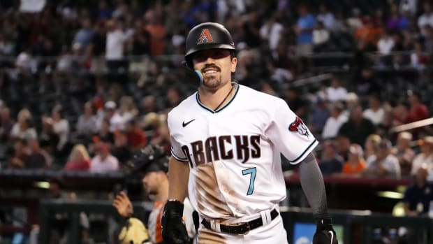 Corbin Carroll smiles after hitting his 25th home run of the season against the San Francisco Giants.