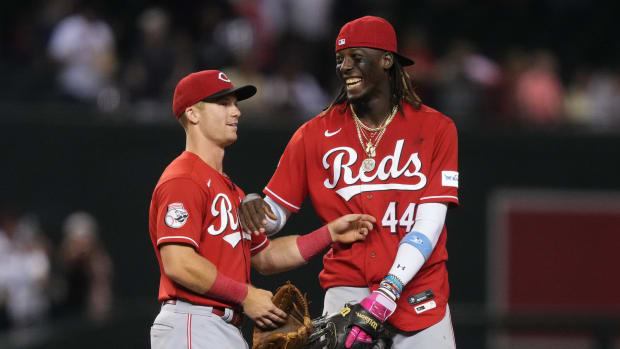 Aug 26, 2023; Phoenix, Arizona, USA; Cincinnati Reds second baseman Matt McLain (9) and Cincinnati Reds shortstop Elly De La Cruz (44) celebrate after defeating the Arizona Diamondbacks at Chase Field. Mandatory Credit: Joe Camporeale-USA TODAY Sports  