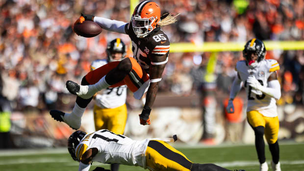 Nov 19, 2023; Cleveland, Ohio, USA; Cleveland Browns tight end David Njoku (85) leaps over Pittsburgh Steelers safety Trenton Thompson (17) during the first quarter at Cleveland Browns Stadium.