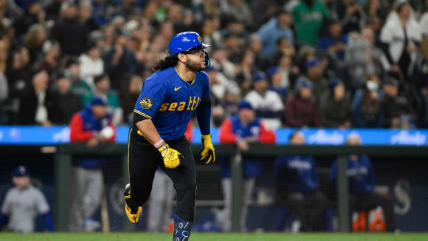 Sep 29, 2023; Seattle, Washington, USA; Seattle Mariners third baseman Eugenio Suarez (28) runs towards first base after hitting an RBI double against the Texas Rangers during the third inning at T-Mobile Park. Mandatory Credit: Steven Bisig-USA TODAY Sports  