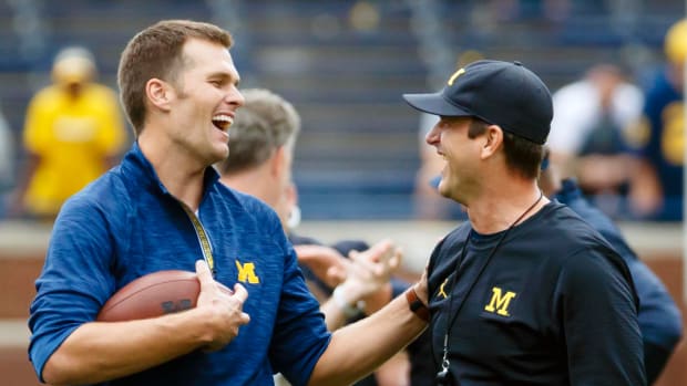 Sep 17, 2016; Ann Arbor, MI, USA; New England Patriots quarterback Tom Brady and Michigan Wolverines head coach Jim Harbaugh laugh during warm ups prior to the game against the Colorado Buffaloes at Michigan Stadium.