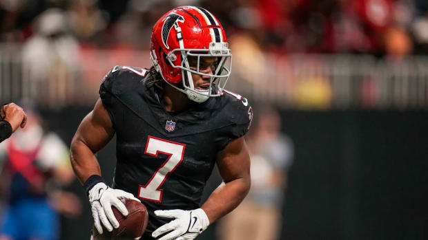 Nov 26, 2023; Atlanta, Georgia, USA; Atlanta Falcons running back Bijan Robinson (7) reacts after scoring a touchdown after a catch against the New Orleans Saints during the second half at Mercedes-Benz Stadium.