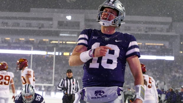 Nov 25, 2023; Manhattan, Kansas, USA; Kansas State Wildcats quarterback Will Howard (18) celebrates a touchdown in the third quarter against the Iowa State Cyclones at Bill Snyder Family Football Stadium. Mandatory Credit: Scott Sewell-USA TODAY Sports