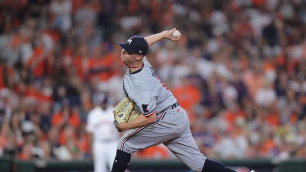 Oct 7, 2023; Houston, Texas, USA; Minnesota Twins relief pitcher Emilio Pagan (15) pitches in the eighth inning against the Houston Astros during game one of the ALDS for the 2023 MLB playoffs at Minute Maid Park. Mandatory Credit: Erik Williams-USA TODAY Sports  