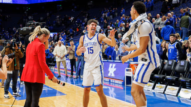 Nov 28, 2023; Lexington, Kentucky, USA; Kentucky Wildcats forward Tre Mitchell (4) dumps water on guard Reed Sheppard (15) after the game against the Miami (Fl) Hurricanes at Rupp Arena at Central Bank Center. Mandatory Credit: Jordan Prather-USA TODAY Sports