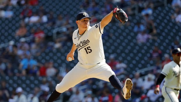 Aug 30, 2023; Minneapolis, Minnesota, USA; Minnesota Twins relief pitcher Emilio Pagan (15) throws to the Cleveland Guardians in the tenth inning at Target Field. Mandatory Credit: Bruce Kluckhohn-USA TODAY Sports  