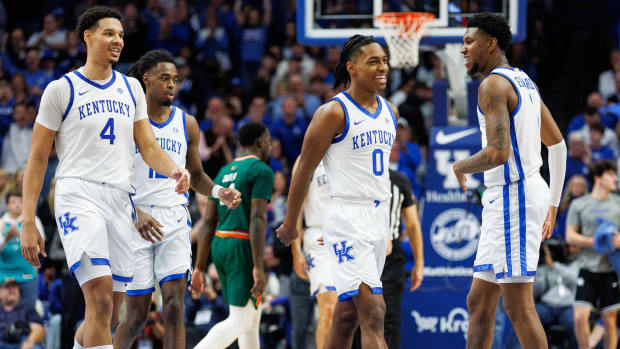 Nov 28, 2023; Lexington, Kentucky, USA; Kentucky Wildcats forward Tre Mitchell (4) and guard Rob Dillingham (0) return to the bench during a timeout in the second half against the Miami (Fl) Hurricanes at Rupp Arena at Central Bank Center. Mandatory Credit: Jordan Prather-USA TODAY Sports