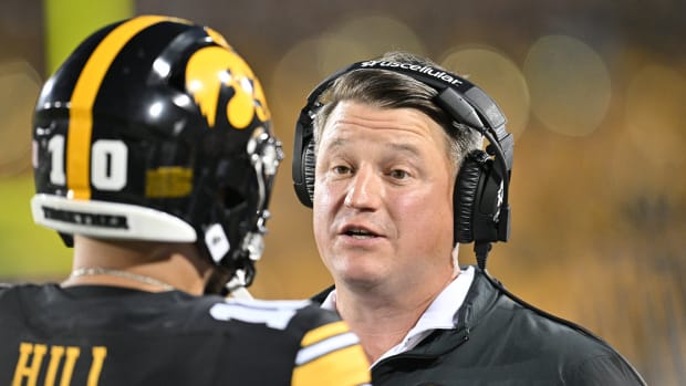 Iowa quarterback Deacon Hill and offensive coordinator Brian Ferentz during the Hawkeyes' 26-16 win over Michigan State on Sept. 30, 2023.