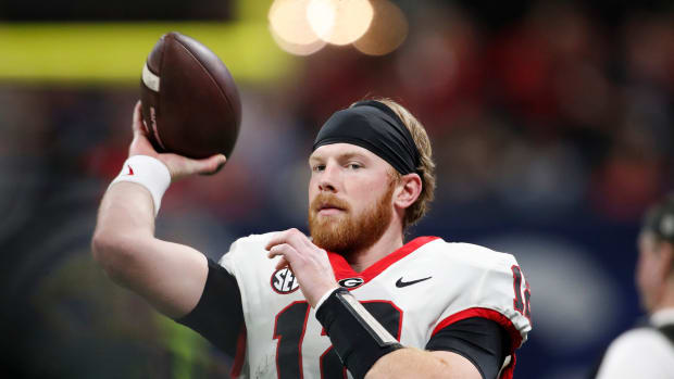 Georgia quarterback Brock Vandagriff (12) warms up before the start of the SEC Championship game against Alabama at Mercedes-Benz Stadium in Atlanta, on Saturday, Dec. 2, 2023.