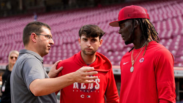 Cincinnati Reds general manager Nick Krall talks with third baseman Elly De La Cruz (44) during batting practice before the MLB National League game between the Cincinnati Reds and the LA Dodgers at Great American Ball Park in downtown Cincinnati on Tuesday, June 6, 2023.  