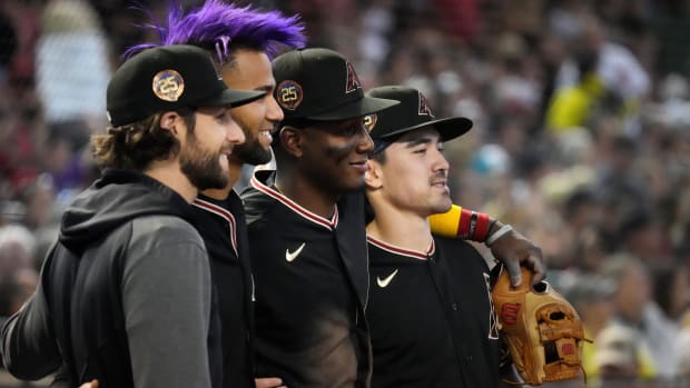 Zac Gallen, Lourdes Gurriel Jr., Geraldo Perdomo, and Corbin Carroll pose for a photo after being named a National League All-Star