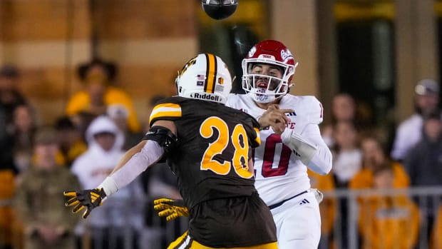 Oct 7, 2023; Laramie, Wyoming, USA; Fresno State Bulldogs quarterback Logan Fife (10) throw against Wyoming Cowboys linebacker Easton Gibbs (28) during the fourth quarter at Jonah Field at War Memorial Stadium.