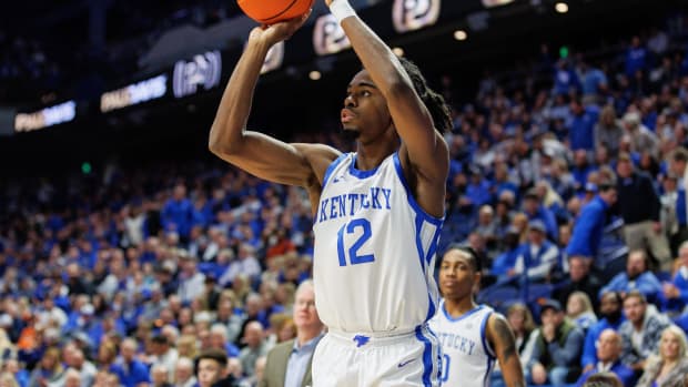 Nov 28, 2023; Lexington, Kentucky, USA; Kentucky Wildcats guard Antonio Reeves (12) shoots the ball during the second half against the Miami (Fl) Hurricanes at Rupp Arena at Central Bank Center