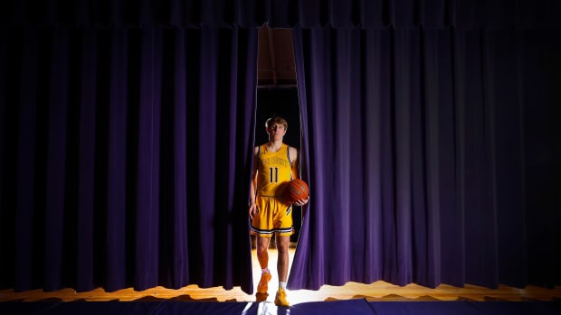 Travis Perry, a junior guard for Lyon County High School boys basketball has 4,.317 points so far. He needs 21 points to pass the record of 4,337 set by\"King\" Kelly Coleman established in 1956. He has been averaging 32.2 points per game and a state best 167 3-point shots this 2022-23 season. March 14, 2023.