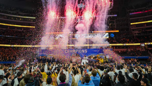 The Missouri Tigers hoist the Field Scovell Trophy following their 14-3 win over the Ohio State Buckeyes in the Goodyear Cotton Bowl Classic at AT&T Stadium.