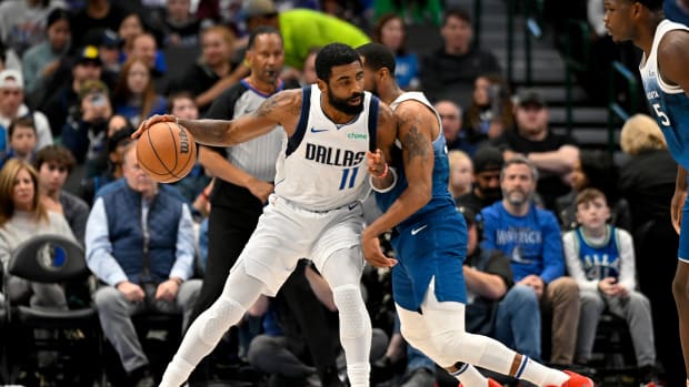 Kyrie Irving backs down Mike Conley