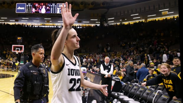 Iowa's Caitlin Clark (22) waves to the crowd as she exits the court after the game against Minnesota Saturday, Dec. 30, 2023 at Carver-Hawkeye Arena in Iowa City, Iowa.