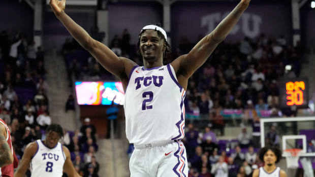 Jan 10, 2024; Fort Worth, Texas, USA; TCU Horned Frogs forward Emanuel Miller (2) reacts after scoring a three point basket against the Oklahoma Sooners during the second half at Ed and Rae Schollmaier Arena.