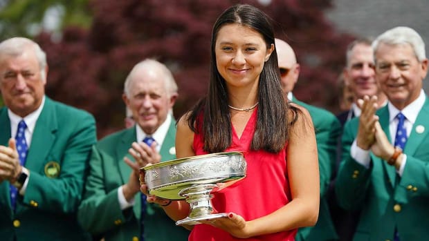 Anna Davis holds the winner's trophy from the 2022 Augusta National Women's Amateur.