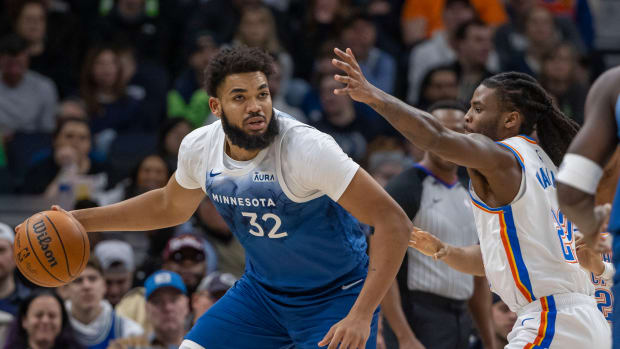 Karl-Anthony Towns drives on Cason Wallace