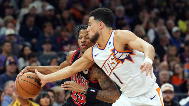 Phoenix Suns guard Devin Booker (1) guards Chicago Bulls forward Dalen Terry (25) during the first half at Footprint Center.