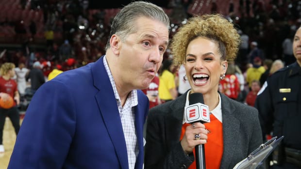 Jan 27, 2024; Fayetteville, Arkansas, USA; Kentucky Wildcats head coach John Calipari talks to the camera as ESPN reporter Jess Sims looks on after the game against the Arkansas Razorbacks at Bud Walton Arena. Kentucky won 63-57. Mandatory Credit: Nelson Chenault-USA TODAY Sports