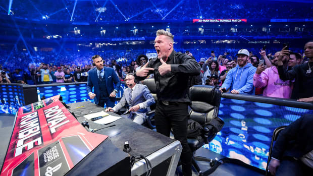 Pat McAfee at the announcer's table during the Royal Rumble