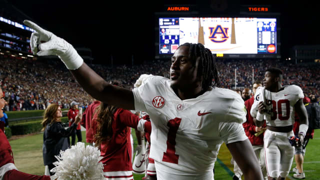 Alabama Crimson Tide defensive back Kool-Aid McKinstry (1) celebrates as he leaves the field after defeating the Auburn Tigers at Jordan-Hare Stadium. Alabama defeated Auburn in four overtimes.