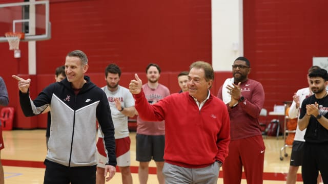 Nick Saban and Nate Oats at Alabama basketball practice.