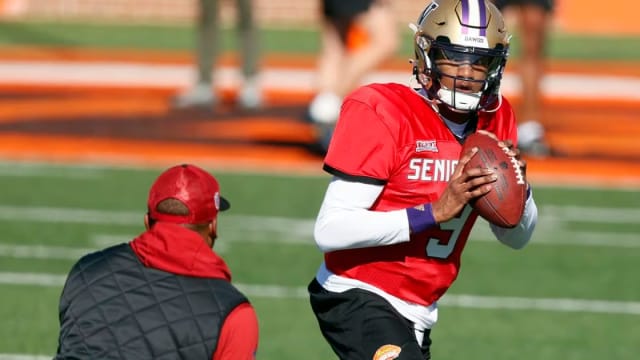 National quarterback Michael Penix Jr., of Washington, runs drills during practice for the Senior Bowl, Tuesday, Jan. 30, 2024, in Mobile, Ala.