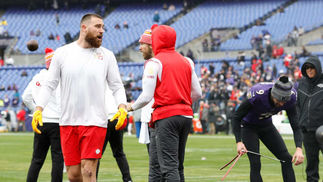 Jan 28, 2024; Baltimore, Maryland, USA; Kansas City Chiefs tight end Travis Kelce (87) exchanges words with Baltimore Ravens place kicker Justin Tucker (9) for warming up in the Chiefs' facility prior to the AFC Championship football game at M&T Bank Stadium. Mandatory Credit: Geoff Burke-USA TODAY Sports  