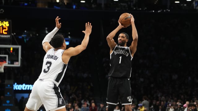 Brooklyn Nets small forward Mikal Bridges (1) shoots a three point jump shot over San Antonio Spurs small forward Keldon Johnson (3) during the second half at Barclays Center.