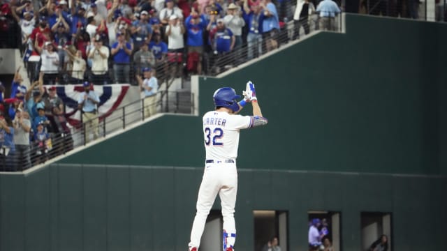 Texas Rangers left fielder Evan Carter celebrates after hitting an RBI double against the Arizona Diamondbacks during the first inning in Game 1 of the 2023 World Series at Globe Life Field in Arlington on Oct. 27.