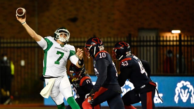 Oct 30, 2021; Montreal, Quebec, CAN; Saskatchewan Roughriders quarterback Cody Fajardo (7) passes the ball against Montreal Alouettes defensive lineman Nick Usher (10) in the first quarter during a Canadian Football League game at Molson Field. Mandatory Credit: Eric Bolte-USA TODAY Sports  