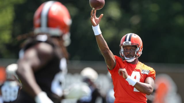 Cleveland Browns quarterback Deshaun Watson throws a pass to running back Kareem Hunt during the NFL football team's football training camp in Berea on Wednesday. Watson Camp 4